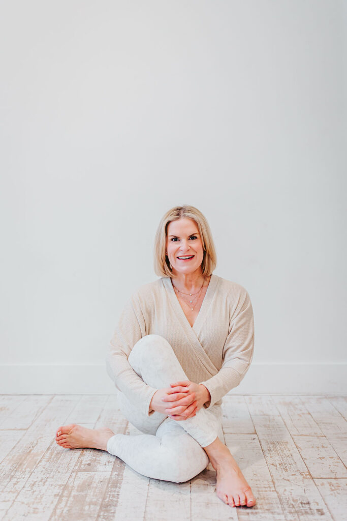 Melissa Trotman, owner of Vital You Functional Medicine based in Annapolis, Maryland, posing in a yoga pose.